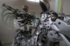 Moto & Metal NESTER CUSTOM mākslas galerija Preiļos ir izklaides komplekss ar izstāžu zālēm, individualizētiem motocikliem un metāla mākslas skulptūrā 12